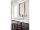 Bathroom featuring a square basin sink, vanity, mirror, and decor at 4730 S Acoma St, Englewood, CO 80110