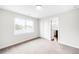 Bedroom with large window, closet, and en-suite bathroom providing a bright and airy feel at 4730 S Acoma St, Englewood, CO 80110