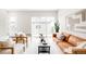 Bright living room featuring modern furnishings, stylish decor, and a large window allowing natural light at 4730 S Acoma St, Englewood, CO 80110