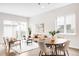 Spacious living and dining area, with modern furniture, large windows, creating a bright and welcoming atmosphere at 4730 S Acoma St, Englewood, CO 80110