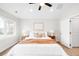 A cozy main bedroom with soft carpet, a queen size bed, side tables, and stylish decor at 4730 S Acoma St, Englewood, CO 80110