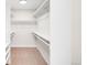 Spacious walk-in closet with adjustable shelving and ample storage for clothes, shoes, and accessories at 4730 S Acoma St, Englewood, CO 80110