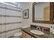 Bathroom features granite countertop, modern fixtures, framed mirror, and shower with curtain at 532 Kimmes Ln, Breckenridge, CO 80424