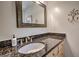 Stylish bathroom featuring granite countertops, a modern sink, and a decorative mirror for an elegant touch at 532 Kimmes Ln, Breckenridge, CO 80424