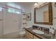 Bright bathroom features shower-tub, granite countertop, framed mirror, and modern fixtures at 532 Kimmes Ln, Breckenridge, CO 80424