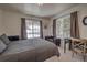 Bedroom boasts natural light, mountain views, a comfortable bed, a relaxing lounge chair, and functional workspace at 532 Kimmes Ln, Breckenridge, CO 80424