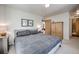 Comfortable bedroom with neutral tones, features a cozy bed and wood accents, creating a relaxing space at 532 Kimmes Ln, Breckenridge, CO 80424