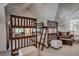 Bonus room featuring multiple bunk beds and a comfortable seating area for Gathering fun at 532 Kimmes Ln, Breckenridge, CO 80424