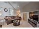 Cozy bonus room featuring a comfortable sofa, TV, and natural lighting at 532 Kimmes Ln, Breckenridge, CO 80424
