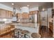 Bright kitchen features a large island with seating, stainless steel appliances, and wooden cabinets at 532 Kimmes Ln, Breckenridge, CO 80424