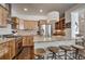 Spacious kitchen island with breakfast bar, stainless steel appliances, and wooden cabinets at 532 Kimmes Ln, Breckenridge, CO 80424