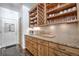 Beautiful kitchen with granite countertops, wooden cabinets, and open shelving at 532 Kimmes Ln, Breckenridge, CO 80424