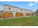 Spacious grassy backyard with wooden fences separating the properties at 6742 S Independence St, Littleton, CO 80128