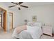 Bright bedroom with vaulted ceilings, ceiling fan, and a pink bedside table at 6742 S Independence St, Littleton, CO 80128