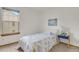 Bright bedroom with a single bed, a window, and a blue bedside table at 6742 S Independence St, Littleton, CO 80128