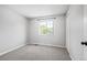 Carpeted bedroom with neutral walls and a window at 11345 Marshall Ct, Westminster, CO 80020