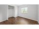 Neutral bedroom with hardwood floors and closet at 11345 Marshall Ct, Westminster, CO 80020