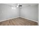 Bedroom featuring laminate wood flooring, a ceiling fan, and bright natural light from a window at 11345 Marshall Ct, Westminster, CO 80020