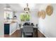 Open concept dining room area with views of the backyard from the kitchen at 11345 Marshall Ct, Westminster, CO 80020