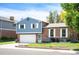 Well-maintained two-story home with brick and siding, featuring a manicured lawn, front yard garden and attached garage at 11345 Marshall Ct, Westminster, CO 80020