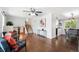 Spacious living area with staircase, wood floors, comfortable seating, and ample natural light at 11345 Marshall Ct, Westminster, CO 80020
