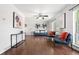 Inviting living room boasts wood floors, modern decor, plenty of natural light, and open layout at 11345 Marshall Ct, Westminster, CO 80020