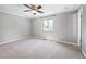 Main bedroom featuring a ceiling fan and neutral carpeting at 11345 Marshall Ct, Westminster, CO 80020