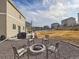 Serene backyard with a fire pit and seating, ideal for outdoor relaxation at 42729 Ivydel Cir, Elizabeth, CO 80107