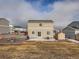 Large backyard with a fire pit, patio, and ample space for entertainment at 42729 Ivydel Cir, Elizabeth, CO 80107