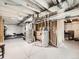 Unfinished basement with visible ceiling pipes, ready to customize at 42729 Ivydel Cir, Elizabeth, CO 80107