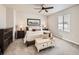 Comfortable bedroom with a ceiling fan, stylish decor, and a well-lit interior at 42729 Ivydel Cir, Elizabeth, CO 80107
