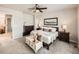 Serene bedroom featuring plush carpeting, ceiling fan, and ample natural light at 42729 Ivydel Cir, Elizabeth, CO 80107
