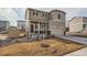 Two-story home with a covered porch, two-car garage, and neutral siding at 42729 Ivydel Cir, Elizabeth, CO 80107