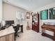 Inviting home office with dual monitors, guitar, and plenty of shelving for storage at 42729 Ivydel Cir, Elizabeth, CO 80107