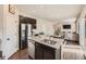 Open-concept kitchen with stainless steel appliances and view to living room at 42729 Ivydel Cir, Elizabeth, CO 80107