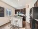 Modern kitchen with granite counters, stainless steel appliances, and bar seating at 42729 Ivydel Cir, Elizabeth, CO 80107
