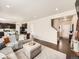 Open-concept living room with hardwood floors and kitchen view at 42729 Ivydel Cir, Elizabeth, CO 80107