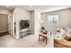 Cozy living room with plush carpet, sofa, and a window offering natural light at 42729 Ivydel Cir, Elizabeth, CO 80107