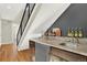 The dry bar features granite countertop, stainless steel refrigerator and storage at 3711 Mariposa St, Denver, CO 80211