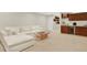Basement lounge area featuring comfortable seating and a convenient wet bar at 3711 Mariposa St, Denver, CO 80211