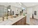 Bathroom features double sinks, decorative fixtures, and a glass enclosed shower at 3711 Mariposa St, Denver, CO 80211