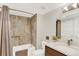 Neutral bathroom featuring a shower-tub with tiled walls and a modern vanity at 3711 Mariposa St, Denver, CO 80211
