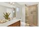 The bathroom showcases a glass enclosed shower and an abundance of natural light at 3711 Mariposa St, Denver, CO 80211