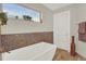 Bathroom boasts a soaking tub with decorative tile surround and fixtures offering a relaxing retreat at 3711 Mariposa St, Denver, CO 80211