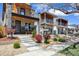 Well-manicured front yard with newly built modern three-story home and 'Coming Soon' sign at 3711 Mariposa St, Denver, CO 80211
