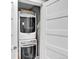 Efficient stacked washer and dryer unit nestled in a closet at 3711 Mariposa St, Denver, CO 80211