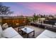 Rooftop deck with comfortable seating and a stunning city skyline view at 3711 Mariposa St, Denver, CO 80211