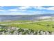 Aerial view of a community with mountain and lake views in the distance at 8544 S Upham Way, Littleton, CO 80128