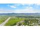Wide aerial shot showcases the community and nearby mountains and highways at 8544 S Upham Way, Littleton, CO 80128
