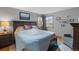 Cozy bedroom with hardwood floors, soft lighting, and a serene atmosphere for restful nights at 8544 S Upham Way, Littleton, CO 80128